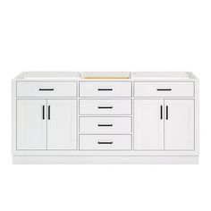 a large white cabinet with two doors and three drawers on the bottom, in front of a