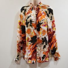 Essentials By Milano Women's Multi Color Blouse Orange, White, Purple, Tan, Black, Yellow, And Burgundy Blouse Has Elastic Neckline And Bottoms Of Sleeves It Also Has A Key Hole Opening Mid Breast Area Of Button Down Front Closure Size Xl Measures From Pit To Pit 42", From Shoulder To Hemline 24", Never Worn. Bin# 41 Yellow And Burgundy, Burgundy Blouse, Color Blouse, Multi Color Blouse, Women Essentials, Key Hole, Orange White, Orange Black, Multi Color