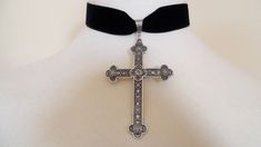 It has a beautiful Large Silver tone cross.The cross is 3" inches ( 7 1/2 cm ) in length.The velvet is approximately 1" ( 2 1/2 cm) wide and on the back you have an extra 2 ½" ( 6 cm) by means of a silver plated extender chain,which fastens with a silver plated clasp or satin tie. Combined shipping on multiple items. PLEASE NOTE: International buyers who pay for Airmail only will NOT get a tracking number as this facility is only available for "International Tracked" Elegant Silver Cross Choker, Cross Choker For Party, Elegant Cross Choker As A Gift, Silver Cross Choker For Party, Adjustable Cross Choker For Gifts, Gift Cross Choker, Halloween Choker, Cross Choker Necklace, Pagan Necklace