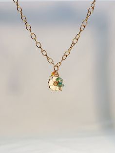 Our 18k gold plated flower charm necklace is a dreamy and whimsical accessory that captures the essence of summer and the beauty of nature. Each flower charm necklace is carefully designed to be adjustable creating a comfortable and unique piece. The combination of the beachy vibes and elegance of the gold plating makes this necklace the perfect addition to your beach-inspired style.  Wether you're looking to embrace your inner beach goddess with a simple necklace look or looking to add a fun la Beach Goddess, Whimsical Necklace, Whimsical Accessories, Flower Charm Necklace, Beachy Vibes, Gold Necklace Simple, Belly Chain, Flower Plates, Beach Inspired