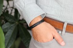 A stylish woven leather bracelet featuring braided leather strap and finished by a secure magnetic clasp. For additional information, please feel free to contact us. Black Leather Casual Wristband, Casual Black Leather Wristband, Casual Black Durable Wristband, Handmade Modern Black Braided Bracelets, Handmade Modern Black Braided Bracelet, Black Braided Bracelets For Everyday, Everyday Black Braided Bracelets, Handmade Black Leather Braided Bracelet, Casual Leather Braided Bracelets