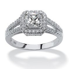 an engagement ring with a square cut diamond surrounded by pave diamonds