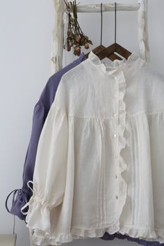 "This is a new-made linen blouse. Fully edged with lace. The sleeves is specially designed. Cuff tied with bow tie. Cute and romantic. Made of 100% nature linen. There are 2 colors available, white and bluish violet. Measures approximately (Loose type, suitable for all body types): 1/2 Bust: 80cm (31.5\") Length: 65cm (25.6\") Shoulder to Shoulder: 57cm (22.44\") ruffle Sleeve: 43cm (17\") There may be 1-2cm measurement margin. ---------------------------------------- Linen is a washable fabric, Romantic White Blouse, White Linen Vintage Blouse, Vintage White Linen Blouse, White Linen Blouse With Lace Trim, Shomiz Blouses, Tunik Linen, White Shirt Design, Vintage Sleeves, Ruffle Shirts