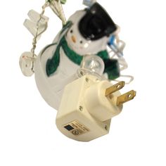 a christmas ornament with a snowman on it's head and lights