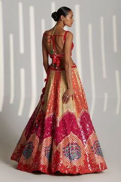 Multicolored applique raw silk lehenga with attached cancan, embroidered with mirror and gota encrusted in tonal silken threads. Paired with sleeveless embroidered, padded blouse and sheer dupatta.
Component: 3
Pattern: Embroidered
Type Of Work: Floral
Neckline: Sweetheart
Sleeve Type: Sleeveless
Fabric: Raw Silk
Color: Multi Color
Other Details: 
Tassel detail
Sheer dupatta
Floral motifs
Occasion: Sangeet,Bride - Aza Fashions Party Choli With Multicolor Embroidery And Cutdana, Party Multicolor Raw Silk Choli, Multicolor Raw Silk Lehenga With Dori Work, Multicolor Raw Silk Sharara For Wedding, Multicolor Dori Work Dress For Reception, Fitted Multicolor Raw Silk Dress, Multicolor Fitted Raw Silk Dress, Multicolor Raw Silk Choli For Wedding, Fitted Multicolor Raw Silk Lehenga