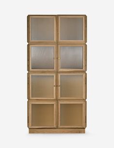 a wooden cabinet with glass doors on the front and side panels in light wood, against a white background