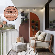 a balcony with two chairs and a couch on the floor next to an orange door