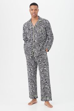 Mr Turk x BedHead Pajamas Organic cotton poplin adds lightweight breathability to this men's pajama set with a long-sleeve button-up shirt and long pants to keep you cool and comfortable all night long. Notch collar Chest pocket Long sleeves Contrast knit piping Four front buttons Length: 30.5" Long Pants Elastic waistband with drawstring Side pockets Contrast knit piping Inseam: 31" Set Two-piece set includes long-sleeve button-up shirt and long pants Runs true to size Model is 6'1", wearing si Pajamas Cozy, Mens Pajamas Set, Notch Collar, Mens Pajamas, Pj Sets, Long Pants, Cotton Poplin, Chest Pocket, Mens Long Sleeve