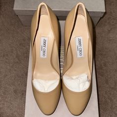 -Brand New With Box, Dust Bag And Jimmy Choo Care Card -Eu 39.5 / Fit Is At Least 1 Size Small (Recommended For 8 With Wide Feet, 8.5 With Normal Width And 9 With Narrow Feet) -Nude Soft Kidskin Leather Exterior -Shiny Patent Heel -Rounded Closed Toe -85 Mm (3.5 Inch) Slim, Stiletto Heel -100% Authentic - Made In Italy -$850 Current Rental, Priced To Sell Disclaimers -Slight Creasing To The Leather On Both Shoes Shown In The Photo From Try Ons (Shown In Photos 7 And 8) -Small Discolored White Sp Beige Calf Leather Heels With Padded Heel, Beige Leather Heels For Business, Beige Calf Leather High Heels, Beige Leather Heels For Office, Cream High Heel Calf Leather Heels, Cream Calf Leather High Heels, Beige Leather Heels For Work, Beige Leather Office Heels, Cream Heels With Branded Heel Counter For Office