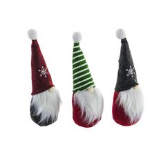 three small christmas gnome hats with snowflakes on the top one is red, green and white