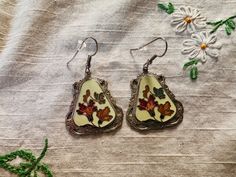 Beautiful vintage cloisonné dangle floral butterfly earrings. 2' long. A pair. Please see pictures. Vintage Enamel Flower Earrings, Vintage Silver Metal Flower Earrings, Vintage Nickel-free Enamel Earrings, Vintage Pierced Enamel Earrings, Vintage Silver Pierced Flower Earrings, Vintage Silver Flower Earrings Pierced, Vintage Flower-shaped Nickel-free Earrings, Vintage Nickel-free Flower Earrings, Vintage Flower Shaped Nickel Free Earrings