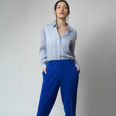 A relaxed fit that works on its own but still fits comfortably under a jacket. Made from drapey tencel fabric with a slight drop shoulder but tailored details like a covered placket, button cuffs and a curved shirt tail keep this button up shirt feeling modern and sophisticated. The rounded collar offers a feminine finishing touch. Wear tucked or untucked. 100% Tencel Curved Shirt, Shirt Blouses Women's, Tencel Fabric, Brand Magazine, Gifts For New Mums, Blazer With Jeans, Pearl Jewellery Earrings, August Birth Stone, Independent Designers Fashion