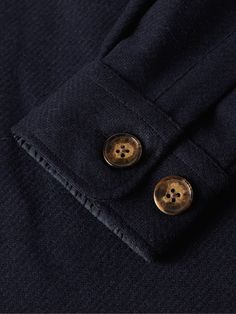 Inspired by utilitarian field styles, Portuguese Flannel’s overshirt is cut for a regular fit and lined in satin for smooth layering. It’s made from warm wool-tweed by master artisans using traditional techniques that have been passed down for generations. Wool Tops With Welt Pockets For Workwear, Navy Wool Tops For Fall, Wool Tops With Button Closure For Work, Wool Workwear Top With Buttons, Wool Tops With Pockets For Workwear, Winter Business Tops With Button Cuffs, Winter Business Casual Tops With Button Cuffs, Business Casual Winter Tops With Button Cuffs, Fall Wool Tops With Button Cuffs