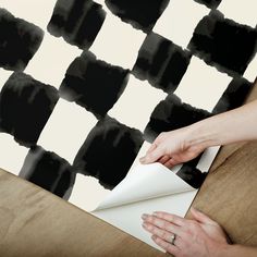 Embrace a little bit of whimsy with this watercolor checkerboard pattern, hand drawn by Mr. Kate. This funky geometric adds a pop of color and playfulness to any space in just Peel, Stick…Done!® Tess Watercolor Soft Black Checker Peel and Stick Wallpaper comes on one roll that measures 20.5 inches wide by 18 feet long. Use our Mr. Kate Tess Watercolor Checker Peel and Stick Wallpaper in: Bedrooms Living Rooms Offices Bathrooms Dorms Furniture Electronics Appliances And so much more! Our Peel and Roommate Decor, Mr Kate, Dorm Furniture, Mirrored Wallpaper, Wallpaper Modern, Checkerboard Pattern, Modern Wallpaper, Cole And Son, Wallpaper Online