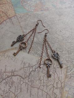 Copper colored compass key earrings made with matching copper chain and 2 styles of copper key charms. Perfect for concerts, gifts, or just everyday wear! Kpop Earrings, Key Earrings, Key Charms, Copper Key, Double Knot, Copper Chain, Compass, Halloween Shopping, Stray Kids