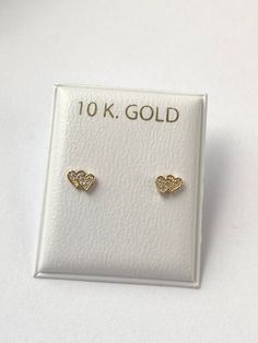 Solid yellow gold stud earrings, with a  gorgeous gold heart shape with cubic zirconia , perfectly designed for all ages but crafted with safety screw backs to protect the ears of children young girls and toddlers.  The 10K gold earring is perfect for babies, young girls and teenagers and beautiful enough for adults as well. Details: Metal: 10K Solid Gold Size: 3.8x5mm Back: screw back Condition: New Note: All parts are inspected before shipping, we are not responsible if you/or your baby lost the backings.  This Jewelry is meant to be adorned under adult supervision. Never leave young children unattended with our products. Please understand that the photos are ENLARGED to show detail for your benefit- please use the measurements provided in the item details/description to understand the s Gold 14k Diamond Earrings Gift, Gold Double Heart Earrings For Anniversary, Gold Heart-shaped Diamond Earrings For Wedding, Yellow Gold Heart Earrings For Mother's Day Anniversary, Yellow Gold Heart Earrings For Anniversary And Mother's Day, Yellow Gold Heart Earrings For Anniversary On Mother's Day, Hypoallergenic Yellow Gold Anniversary Earrings, Hypoallergenic Yellow Gold Earrings For Anniversary, Yellow Gold Birthstone Earrings For Birthday