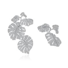 Material: Copper, Gold Plated, Cubic ZirconiaSize: 6cm by 3.9cm, 2.9cm by 2.5cmWeight: 15.3g per pairDesign: Asymmetrical Crystal Palm Leaves Drop Statement EarringsColor: White, Silver Western Earring, Western Earrings, Buy Earrings, Statement Drop Earrings, Large Jewelry, Cubic Zirconia Earrings, Cz Jewelry, Large Earrings, Cz Diamond