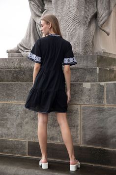 Crafted in an airy cotton with a notched V neckline and delicate contrast embroidery, this easy dress is equal parts classic and fresh. Pair with simple white sneakers and a crossbody for a casual warm-weather day, or with sandals and sunnies for your next getaway! Timeless and modern, it’s a must-have as you refresh your wardrobe. 100% cotton dress. Gently a-lines below the waist and features gentle tiers. On seam pockets. Flattering V neckline with embroidered collar. Lined. Embroidery through Summer V-neck Dress With Embroidered Hem, Spring Beach Black Embroidered Dress, Black Embroidered Beach Dress For Spring, Spring Beach Embroidered Black Dress, Summer Mini Length Embroidered Dress, Summer Embroidered Hem Mini Dress, Summer Mini Embroidered Dress With Hem Detail, Casual V-neck Dress With Embroidered Hem, Cotton Day Dresses With Embroidered Hem