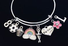 Use this link if you would like to add Birthstones to this bracelet ~ https://www.etsy.com/listing/774404837Little Girl Size adjustable bracelet normally fits children 8 -13 years old (estimation). (This is the Medium Size)Expandable and Completely Adjustable. Medium Size pictured is 4 1/2 inches.  Can be adjusted as small as needed by Gently squeezing the bracelet smaller.  This Medium sized Child bracelet will expand to fit up to a 6 inch wrist.  Stainless Steel Split rings attach charms to ba Silver Novelty Charm Bracelet For Birthday, Novelty Multicolor Charm Bracelet For Birthday, Cute Nickel-free Charm Bracelet For Birthday, Fun Charm Bracelets For Birthday, Fun Charms Bracelets For Birthday, Fun Birthday Charms Bracelets, Cute Nickel-free Bracelets For Birthday, Novelty Handmade Charm Bracelet For Birthday, Birthday Charm Bangle Bracelet