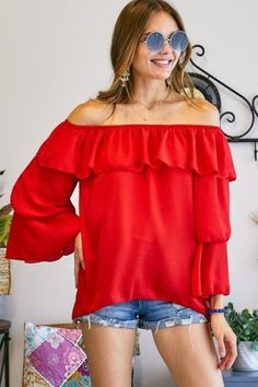 The Black Off The Shoulder Top can be styled with shorts, jeans, pants or just about anything! Description: TRIPLE LAYERED BELL-SLEEVE OFF SHOULDER TOP100% POLYESTER. MADE IN USA.Category: Bella Chic Tops & TeesFabric: 100% POLYESTER.Made In: USA Red Off-shoulder Tops For Fall, Casual Red Off-shoulder Top, Fall Off-shoulder Red Tops, Fall Season Red Off-shoulder Tops, Flirty Ruffled Tops For Fall, Flirty Red Top With Ruffles, Long Sleeve Flirty Top For Summer, Off-shoulder Ruffle Top For Date Night, Red Off-shoulder Blouse For Party