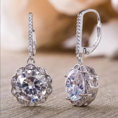 Brand New Women's White Gold Drop Earrings 18k White Gold Plated Sterling Silver Genuine 2ct Lab Created Diamonds Measurements 1.5" H X 5." L X .25" W Retail Price $350 Buy With Confidence From A Trusted Seller W/ A 99%+ Feedback Rating! A0184 (Id-187-) Classic Silver Bridal Earrings For Formal Occasions, Formal Diamond White Crystal Earrings With Halo Design, Dazzling White Gold Earrings With Halo Setting, Elegant Diamond White Crystal Earrings With Halo Design, Fine Jewelry White Gold Crystal Earrings, Elegant Round Crystal Earrings With Diamond Accents, Formal Cubic Zirconia Crystal Earrings With Halo Design, Fine Jewelry White Gold Round Crystal Earrings, Formal Halo Design Crystal Earrings With Cubic Zirconia