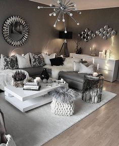 a living room filled with lots of furniture and decor