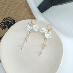 Check out our bow shaped pearl tassel earrings. Such an elegant pair of earrings, that would be perfect for just the right outfit. Elegant Pearl Drop Tassel Earrings, Elegant Pearl Drop Tassel Earrings For Wedding, Elegant Formal Tassel Drop Earrings, Gold Pearl Drop Tassel Earrings For Party, Gold Tassel Earrings With Pearl Drop For Party, Elegant Pearl Drop Dangle Tassel Earrings, Elegant Pearl Drop Tassel Earrings For Party, Chic Tassel Earrings For Evening, White Pearl Charm Chandelier Earrings For Party