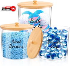 two clear containers filled with blue and white candies next to each other on a white background