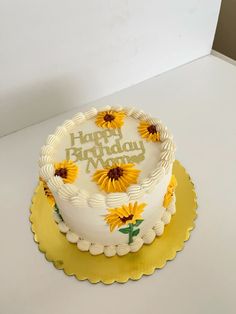 a birthday cake decorated with sunflowers and the words happy birthday written on it