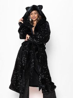 Women's Long Black Sequin Coat - Classic Our Long Sequin Coats for Women in black feature a faux fur hood with ears, a sequin wrap belt, a secret interior stash pocket, and luxurious sequins throughout. This gorgeous, dreamy coat will sparkle and stand out at any festival, party, or evening out. Turning heads has never felt prettier! Black Panther Characteristics MYSTERIOUS • INSPIRING • PROTECTIVEDo you have the Spirit of the Sequin Black Panther? If you do, you can't help but dance in the unkn Glamorous Winter Outerwear With Contrast Sequin, Winter Evening Outerwear With Sequins, Winter Black Outerwear With Contrast Sequin, Black Outerwear With Contrast Sequin For Winter, Love In Black, Sequin Coats, Coat Classic, Wrap Belt