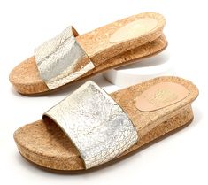 Style your linen pants, big shirts, and breezy dresses with these simple-yet-sophisticated slides. A pretty leather upper and cork bottom bring a by-the-beach vibe to the day's pursuits. From Vince Camuto. Leather Slides With Cork-bed Midsoles For Summer, Cork Sandals For Beach In Summer, Cork Sandals For Beach And Summer, Casual Cork Slides For Summer, Summer Beach Cork Sandals, Chic Cork Sandals For Summer, Cork Sandals For Spring Vacation, Spring Vacation Cork Sandals, Cork Slides For Summer