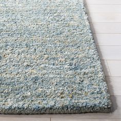 a blue rug on the floor in a room