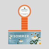 an orange and white award for someone's work in the field with daisies