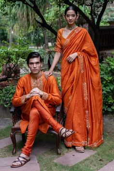 Shop for Deepthee Orange Silk Yoke Embroidered Kurta And Churidar Set for Men Online at Aza Fashions Orange Zari Work Sherwani For Wedding, Orange Sherwani With Zari Work For Wedding, Orange Wedding Sherwani With Zari Work, Wedding Orange Sherwani With Zari Work, Designer Orange Raw Silk Kurta, Orange Raw Silk Kurta For Designer Wear, Orange Raw Silk Kurta For Diwali, Orange Sherwani For Wedding Eid Festival, Orange Sherwani For Wedding And Eid