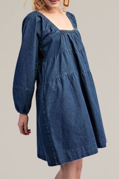 this classic, tiered denim long sleeve dress is crafted from soft, high-quality cotton. it features a flattering square neckline and long sleeves with gathered cuffs for a relaxed yet timeless look. the tiered design adds a playful touch, creating a flowy silhouette that's perfect for any occasion. with practical side pockets, this dress combines comfort and fashion seamlessly. dress it up with statement jewelry or keep it casual with your favorite sneakers for a versatile wardrobe staple. 100% Versatile Wardrobe, Romper With Skirt, Dress Romper, Hat Hairstyles, Square Neckline, Handbags On Sale, Sweater Jacket, Statement Jewelry, Wardrobe Staples