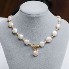 Celebrate your love for all things vintage with this handmade baroque pearl matching set. Each shimmering white cultured pearl features a unique shape, making these pearls a true treasure from the sea to cherish. Shiny, rich yellow gold plated spacer beads interplay with the pearls, creating a fusion of classic meets trendy style. Elongated hook clasps close the necklace, adding a luxurious touch. Created with an antique inspiration, purchase this set together or separately and showcase their el Luxury Elegant Baroque Pearl Beaded Necklaces, Gold Baroque Pearl Round Necklace, Gold Pearl Necklace With Toggle Clasp, Elegant Gold Toggle Necklace With Pearl Drop, Gold Pearl Elegant Toggle Necklace, Gold Pearl Drop Toggle Necklace, Gold Pearl Toggle Necklace With Pearl Drop, Gold Pearl Toggle Necklace With Pearl Chain, Elegant Gold Pearl Toggle Necklace