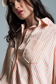 Discover the effortless charm of our Light Orange Oversized Blouse, adorned with crisp white stripes, a must-have addition to your summer collection. Breathable Fabric Composition: Crafted from 100% Polyester, this blouse ensures both durability and comfort, perfect for warm summer days. Eye-Catching Design: Featuring a striking light orange hue complemented by elegant white stripes, this blouse stands out with its refreshing color palette. Versatile Oversized Fit: Designed to run big with an ov Oversize Blouse, Blouse Collar, Stripe Blouse, Oversized Blouse, Color Naranja, White Skirt, Light Orange, Polo Collar, White Skirts