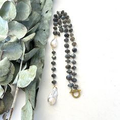 "Labradorite Gemstone White Baroque Pearl Gold Toggle Necklace! You will Fall-In-Love with this unique statement creation of mine. All these rondelle faceted shaped Blue Flash Labradorite Gemstone are individually wire wrapped to a unique Toggle. Hanging to the top and bottom I have added White Baroque Pearls and more genuine Labradorite Gemstone in between.  You can wear this stunning necklace Dressy or Casual as you wish.  What a perfect gift to a loved one as well. PLEASE NOTE: These natural Baroque Pearls are also called 'Kasumi', 'Flameball', or maybe 'Fireball' Pearls and that being Natural Pearls, they are subject to nature's imperfections.  These characteristics enhance the beauty of the product and truly makes them a One Of A Kind Piece. (Detailing) - Total length of the necklace Toggle Necklace, Labradorite Necklace, Labradorite Necklaces, Necklace Pearl, Necklace Long, Pearl Gemstone, Stunning Necklace, Gold Pearl, Baroque Pearls