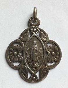 Antique religious medal virgin mary.  it measures 1" without the bail. solid silver. Silver Virgin Mary Pendant Jewelry, Silver Pendant With Miraculous Medal, Silver Miraculous Medal Pendant, Virgin Mary, Coin Collecting, Accessory Gift, Ships, Electronic Accessories, Paper Party Supplies