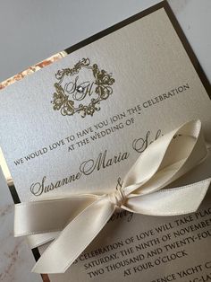 a wedding card with a bow on it