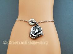 "❖ Film Reel charm: Antique silver pewter. Approx. 6/8\" ❖ Hand Stamped Initial Charm: Antique Silver Pewter. 3/8\" (9mm) Charms are lead free, made in U.S.A. ❖ Bracelet length: 6 & 1/4\" plus 1 & 1/2\" adjustable links = 7 & 3/4\" ❖ No extra charge up to 10\" - Contact me! ❖ Click below for Film Reel charm bracelet in Antique Gold Pewter: https://www.etsy.com/listing/128568080 ❖ Click below for Film Reel charm necklace: https://www.etsy.com/listing/120541105 ❖ Add a birthstone or Fr Vintage Adjustable Jewelry For Mother's Day, Adjustable Novelty Jewelry For Best Friend Gift, Personalized Adjustable Metal Charm Bracelet, Adjustable Metal Charm Bracelet For Best Friend, Adjustable Novelty Jewelry For Personalized Gifts, Personalized Novelty Silver Bracelets, Personalized Silver Novelty Bracelets, Personalized Silver Charm Bracelet For Friendship, Adjustable Stamped Jewelry For Best Friend Gift