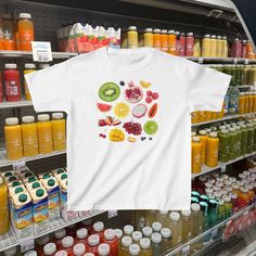 Indulge in summer vibes with our Fruit Collage Baby Tee, a delightful Y2K-inspired piece featuring a charming collage of fruit. This scrapbook aesthetic shirt is a summer crop top perfect for strolling through the farmers market. Click now to add it to your cart and embrace the sweetness of summer! 🫧 SIZING * Available sizes: XS -XL  * This garment is true to size, but size down if you prefer a more fitted look. * Keep in mind, this garment is in youth sizing to achieve the baby tee fit, so it will be more snug around the bust. * Refer to the size chart in the photos for details, we recommend measuring a shirt you already own and love in order to get the perfect fit. 🫧 MATERIALS * 100% Cotton  🫧 CARE * Machine wash cold, inside-out, gentle cycle with mild detergent and like colors * Tum Scrapbook Aesthetic, Fruit Collage, Farmers Market Shirt, Aesthetic Coconut Girl, Aesthetic Coconut, Strawberry Shirt, Summer Crop Top, Aesthetic Shirt, Baby Tees Y2k