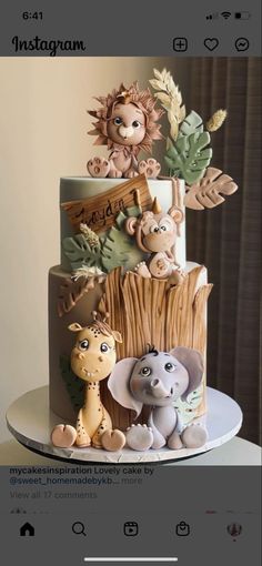 a three tiered cake with animals on it