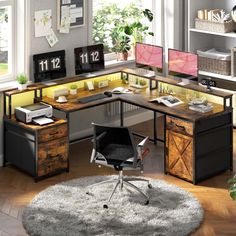 an office desk with two computer monitors and a chair in front of it on top of a rug