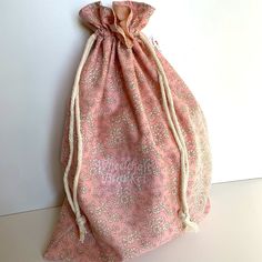 a pink bag sitting on top of a white table