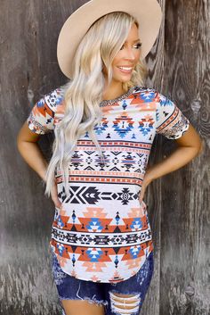 Aztec Print Round Neck Tee Multicolor Bohemian Crew Neck Tops, Bohemian Multicolor Crew Neck Tops, Casual Multicolor Short Sleeve Knit Top, Casual Printed Orange Tops, Casual Orange Blouse With Graphic Print, Orange Printed Short Sleeve Tops, Orange Bohemian Relaxed Fit Top, Round Neck Tees, Aztec Pattern