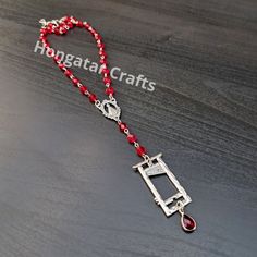 People wear crosses all the time so why not guillotines? Beaded Guillotine necklace with a "blood drop" (you can choose one or three), made in rosary style beading. The red drop is made of glass with alloy setting. The guillotine itself is made of alloy. Bead chain is made of ruby red 6 mm faceted glass beads. Pendant size altogether is 5,5 x 2,2 cm. You can choose the chain length that works best for you. In the picture the chain is 38-42 cm. Or if none of them work for you, just contact me and Guillotine Necklace, Blood Drop, Beads Pendant, Bead Chain, Faceted Glass, Work For You, Ruby Red, Beaded Chain, Rosary