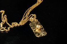 "This is a very beautiful, vintage and unique DIAMOND 14K GOLD pendant necklace (weight 3.2). The necklace has a marvelous engraved decoration, brilliant cut diamond (3.5 mm) and 14K gold (bottom has S-I 14KT) and chain (bottom has 14K). The necklace has a very extravagant and elegant feel to it. It measures 1\" x 7/16\" pendant and 21 1/2 long chain. The necklace is in very good condition. 0.7 MR" Vintage Yellow Gold Diamond Necklace, Vintage Yellow Gold Diamond Necklace For Formal Occasions, Heirloom Diamond Necklace With Intricate Design, Anniversary Diamond Pendant Necklace With Filigree, Vintage Pendant Diamond Necklace With Single Cut Diamonds, Vintage Gold Necklace With Single Cut Diamonds, Elegant Engraved Diamond Necklace, Classic Diamond Filigree Necklace, Antique Diamond Necklace With Single Cut Diamonds