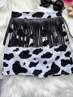 Cow Print Skirt, Toddler Cow Print Skirt, Girls Cow Print Skirt, Animal print Skirt, toddler Animal Print Skirt, Girls Party Skirt, Fringe Please refer to option of skirt style- Front fringe or double side fringe. Processing Time: 3- 5 Business Days from date of purchase. Please note, shipping time is aside from processing time, items are shipped via USPS. Machine wash cold, and hang dry. No returns or exchanges, unless we made a mistake on our end. Brown Cow Print Skirt Outfit, Cow Print Skirt, Tassel Shirt, Skirt Fringe, Cowgirl Accessories, Front Fringe, Side Fringe, Girls Skirts, Animal Print Skirt