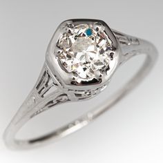 This elegant circa 1920s Belais Brothers ring contains one (1) old European cut diamond weighing 0.61 carat that is bead set into a hexagonal shaped setting. The head and shoulders of the ring features a pierced design. The ring measures 7.8mm at the top, rises 8.1mm above the finger, tapering to 1.1mm wide and 1.0mm thick at the base of the shank. Signed Belais. This ring is currently a size 6 5/8. Luxury Antique Diamond Ring With Single Diamond, Antique Diamond Ring With Single Cut Diamonds As Gift, Antique Blue Diamond Ring Hallmarked, Antique Hallmarked Sterling Silver Diamond Ring, Antique Hallmarked Diamond Ring Collectible, Chocolate Diamond Ring, Head And Shoulders, Chocolate Diamonds, Head & Shoulders